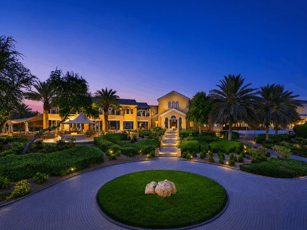 Landscaped villa entrance in Arabian Ranches, Dubai, at dusk