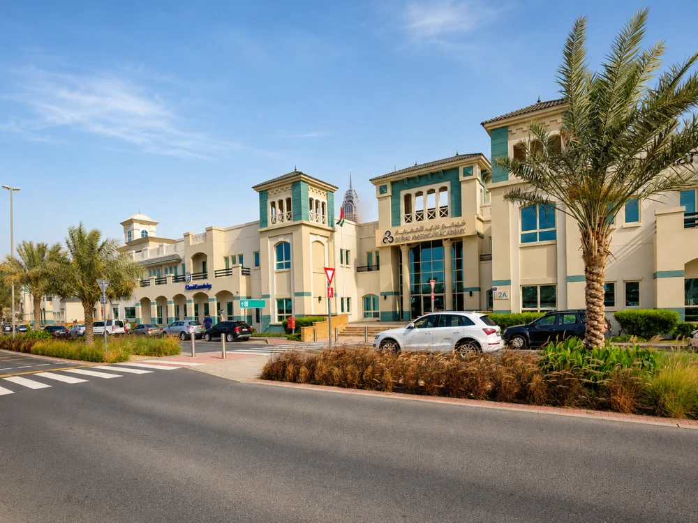 Dubai Knowledge Park buildings with palm trees and landscaped streets.