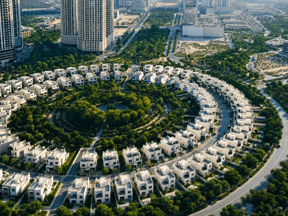 Aerial view of circular villa streets and central park in Jumeirah Village Circle