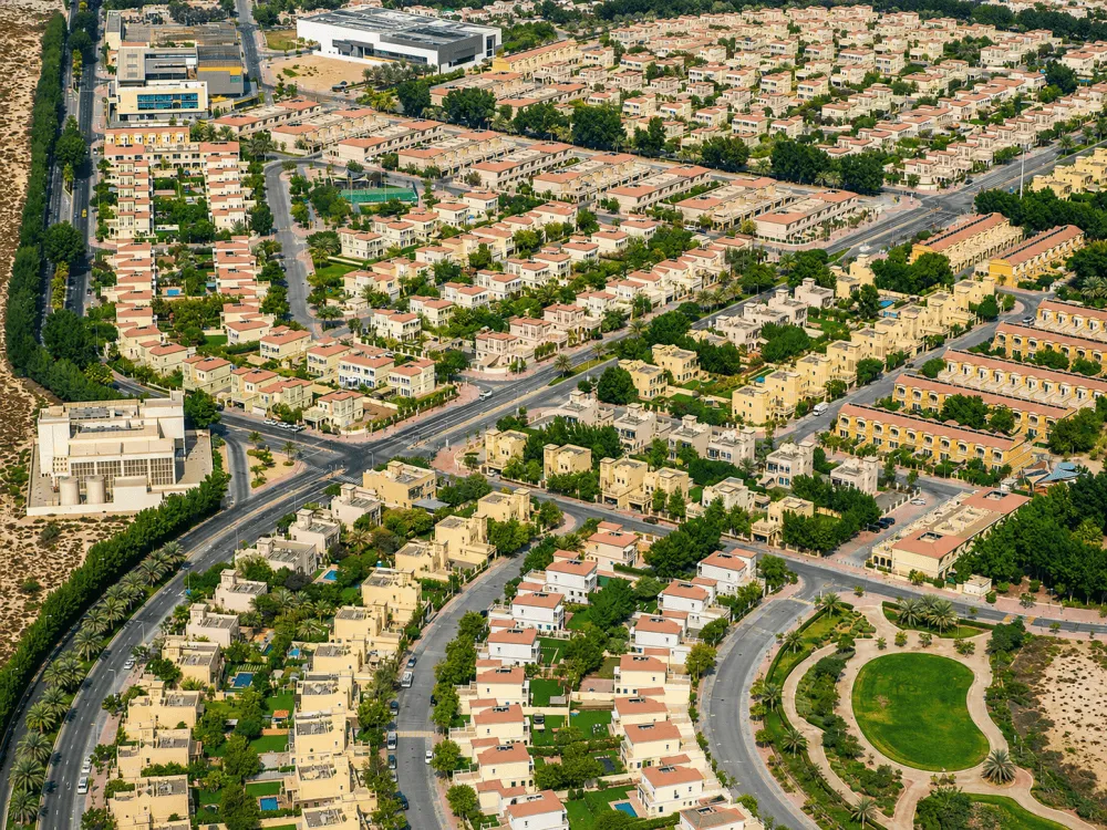 Aerial view of villas, townhouses and green spaces in Jumeirah Village Triangle