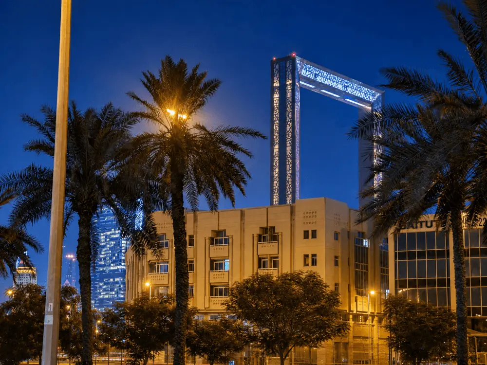 Dubai Frame rising above buildings in Oud Metha at night