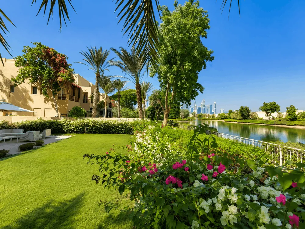 Landscaped lakeside garden and villas in The Meadows, Dubai
