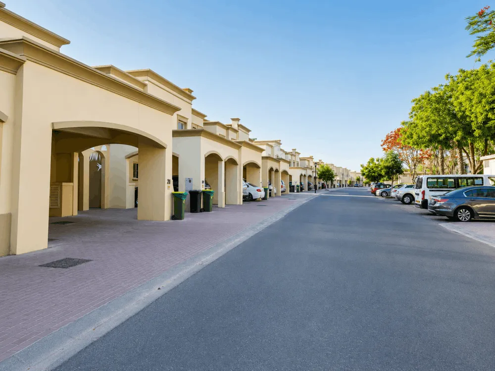 Villas and garages along a residential street in The Springs, Dubai